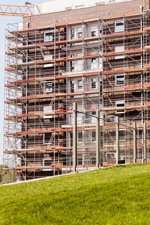 building under construction with scaffolding set