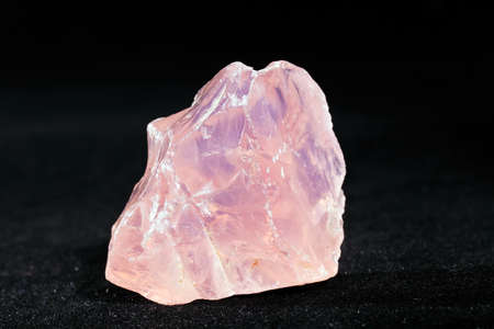 Natural rose quartz isolated on black backgroundの写真素材
