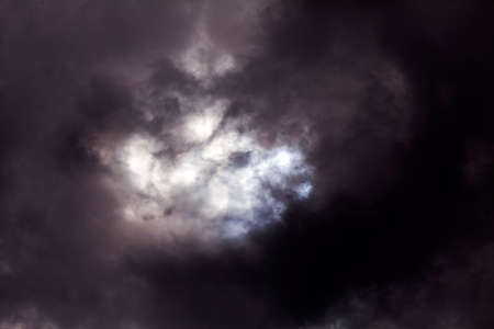 Black sky and rays of sunshine coming through
