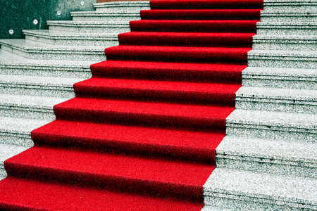 Marble stairs with red carpet, side viewの写真素材