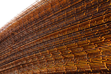 Rusty steel frames on construction site, view from the sideの写真素材
