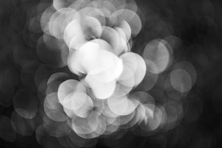 gray abstraction derived from white light on a black background, for blurred background