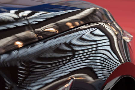 abstract brightness on the black car, note shallow depth of field