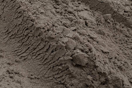 Construction sand near the site, note shallow depth of field