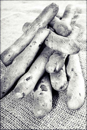 pastry in the form of bars filled with olives on the linen clothの写真素材