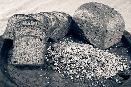 rye bread with seeds on a wooden plate