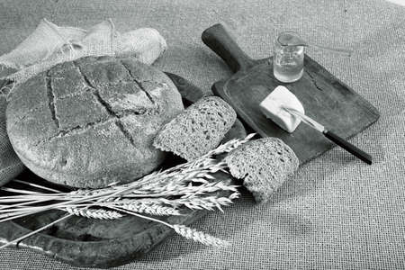Decoration  with round integral bread on wooden board, note shallow depth of fieldの写真素材