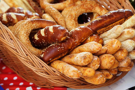 Various bakery products in a wicker basket, note shallow depth of fieldの写真素材