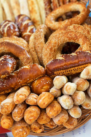 Various bakery products in a wicker basket, note shallow depth of fieldの写真素材