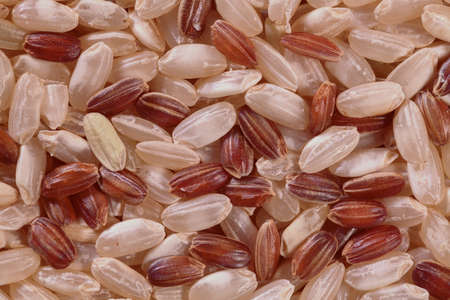 brown rice spilled on the tableの写真素材