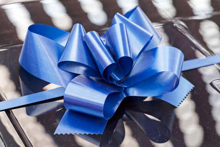 blue ribbon on gift, note shallow depth of fieldの写真素材