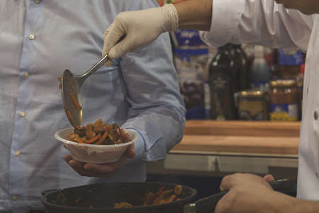 Outpouring of grilled vegetables from the pan, note shallow depth of fieldの写真素材