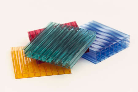 lexan samples in different colors on a white background, note shallow depth of fieldの写真素材