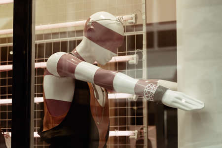 plastic doll in the window for advertising clothing, note shallow depth of fieldの写真素材
