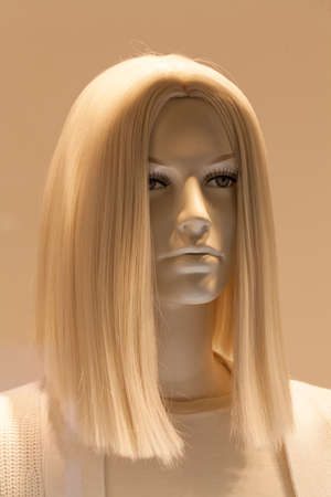 Head of the doll with blond hair, note shallow depth of fieldの写真素材