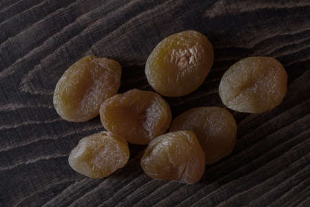 dried apricots on wooden tableの写真素材