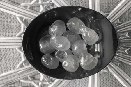 candied cherries in black bowlの写真素材