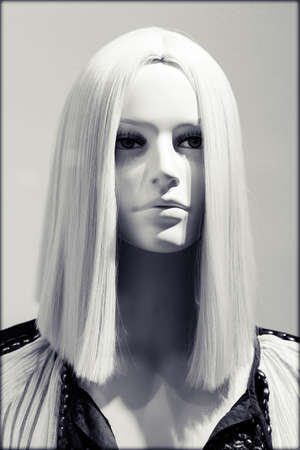 Head of the doll with blond hair, note shallow depth of fieldの写真素材