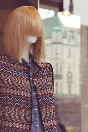 doll with sweater in the shop window, note shallow depth of field