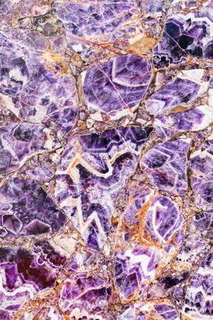 Marble floor  with purple and gold hues, note shallow depth of fieldの写真素材