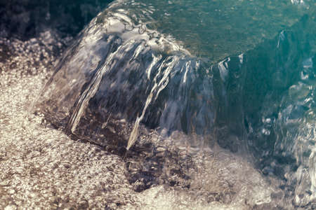 clear mountain running water, note shallow depth of fieldの写真素材