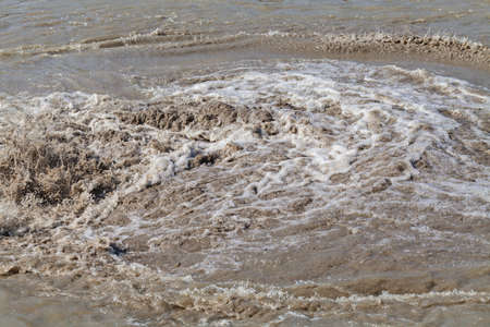 sand and mud in industrial water, note shallow depth of fieldの写真素材