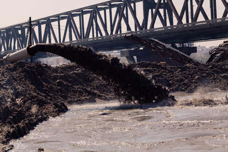 sand and mud in industrial water, note shallow depth of fieldの写真素材