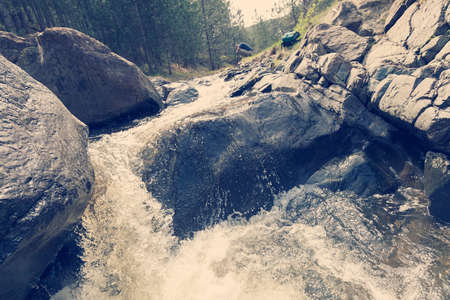 abstraction waterfall in a mountain stream, note shallow depth of fieldの写真素材