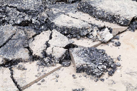 broken asphalt before reconstruction, note shallow depth of fieldの写真素材
