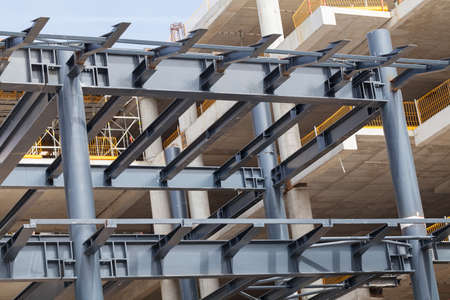 building under construction with scaffolding and crane