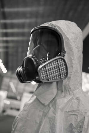 protective suits and masks on the fairの写真素材