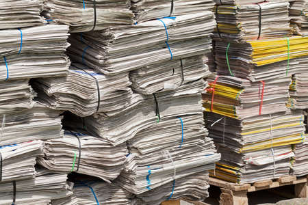 pile of newspapers for recycling in packages , note shallow depth of fieldの写真素材