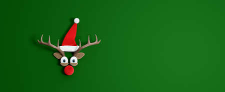 Reindeer with Santa Claus hat. Christmas Holidays concept with green copy space 3d render 3d illustrationの写真素材