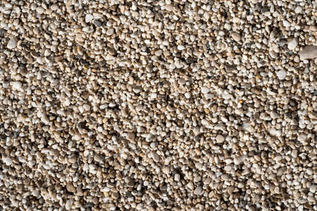 Beautiful small sea stone pebble background. Multicolored abstract beach nature patternの写真素材