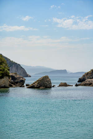 Beautiful summer Mediterranean coast with large sea stonesの写真素材