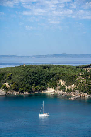 Beautiful summer Mediterranean coast with sailing ship