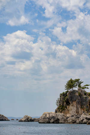 Beautiful summer Mediterranean coast with large sea stonesの写真素材