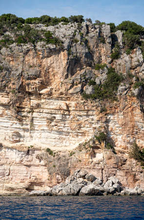 Beautiful summer Mediterranean coast with large sea stonesの写真素材