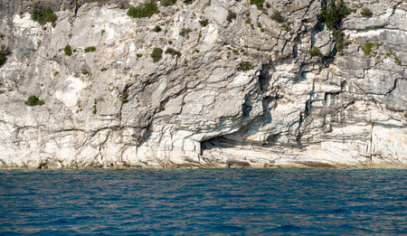 Beautiful summer Mediterranean coast with massive rocky cliff