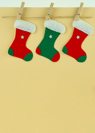 Handmade Creative Christmas greeting card with colorful socks on the rope