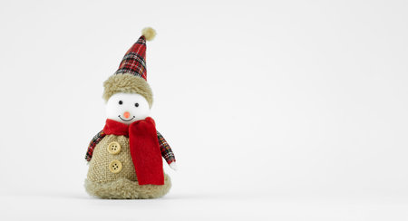 Handmade funny snowman with a fabric suit on white backgroundの写真素材