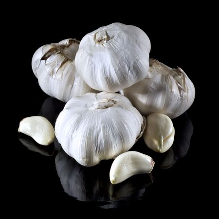 Garlic Arrangement on Black with reflectionsの写真素材