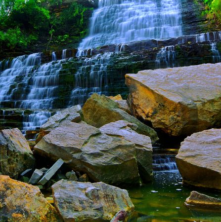 Water cascade onto jagged rocksの写真素材