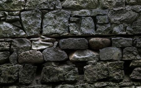 Ancient stone wall with spiderwebsの写真素材