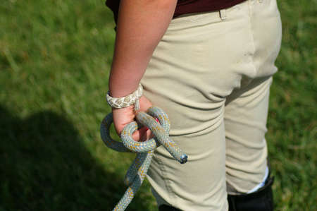 Girl holding ropeの写真素材