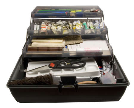 Work toolbox of an artist/designer, full of paints, pensiles, erasers, etc.の写真素材