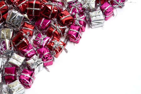 Lots and lots of little colorful and shiny gift boxes with blank space left for your design.の写真素材