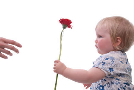 Child gives her mother flowers for Mothers Dayの写真素材