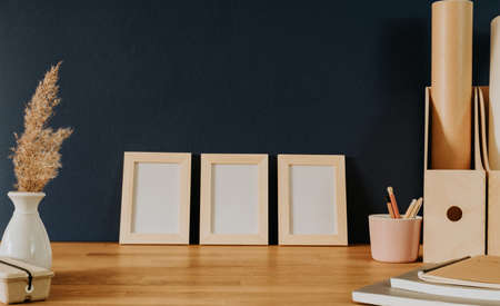 Set of three frames on office deskの写真素材