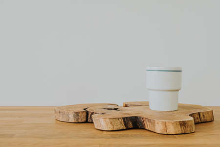 White mug on wooden desk with copy spaceの写真素材